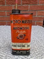 Front and angled view of a vintage rectangular metal oil can labeled Moto-Master with branding and product information.