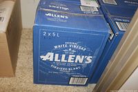 Closed blue cardboard box labeled Allen's Original White Vinegar, showing branding and volume information 2x5L per box.
