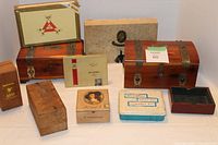 Wide angled photo showing the entire group of various vintage and wooden boxes on white background