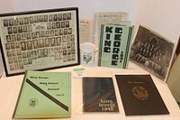 Overview of all items including framed photo, newsletters, annuals, and mug.