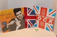 Front view of Michael Bublé vinyl record alongside the Story of British Rock vinyl and the serving tray.