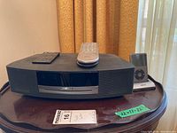 Front view of Bose Wave system with two remotes on top