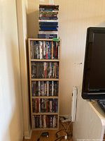 Front view of taller shelving unit filled with DVDs and Blu-rays