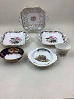 Photo showing six pieces of vintage bone china including serving dishes and bowl with floral and ornate designs