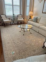 Full view of rug in living room under coffee table and furniture
