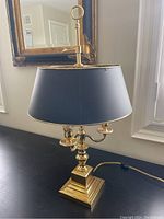 Front view of lamp showing base, shade and overall shape