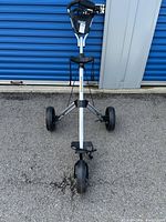 Front view of the Speedster golf caddy showing the handle and wheel arrangement.