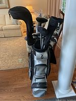 Full view of golf bag with clubs and head covers