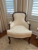 Front view of chair showing overall design, upholstery and condition