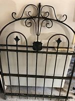 Full front view of gate panel leaning against a surface