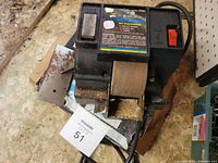 Top view of wet wheel tool sharpener showing control panel, grinding wheel and power switch