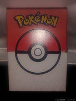 Front view of the boxed Pokemon card deck showing prominent Pokemon logo and Pokeball design.