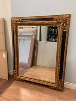 Full front view of the mirror leaning against wall