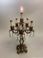 Full view of lamp upright with top bulb lit