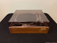 Full front view of the Sony PS-230 turntable system with closed dust cover and wood base visible.