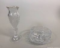 Clear Waterford crystal footed bud vase and footed bowl with diamond cut pattern, shown side by side on a plain background.