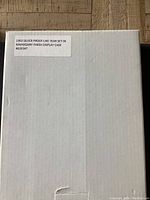 Closed white box with label indicating 1963 silver proof-like year set in mahogany finish display case.