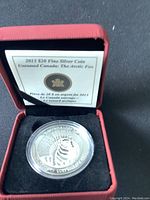 2013 $20 Fine Silver Coin with Arctic Fox design in red presentation box with COA visible inside the lid.