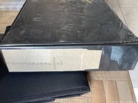 Black binder coin album closed on table