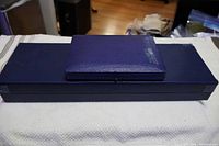 Blue textured box of Birks carving set showing slight wear
