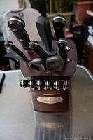 Front view of Cuisinart cutting utensil block showing knives, scissors, and sharpener