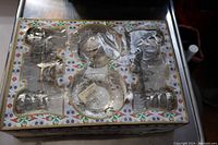 Photo of the boxed Lux Tea Set showing the 6 silver tea glasses and 6 saucers in original packaging.