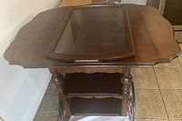 Front view of tea cart with glass tray placed on top
