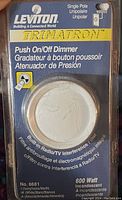 Photo of new Leviton Trimatron single pole push on/off dimmer in original packaging.
