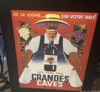 Full view of the vintage French wine advertising poster showing a man in a hat holding a wine bottle with grape decorations