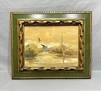 Front view of the framed watercolour painting showing the natural landscape with birds in flight.