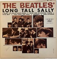 Front cover with album title and multiple photos of The Beatles