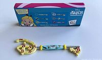 Photo shows the Alice In Wonderland Disney White Rabbit collector key alongside its box. The box displays other collectible key designs and branding.
