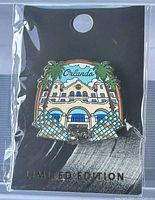 Photo of the sealed Hard Rock Orlando 50th Core Facade collector pin in original packaging with limited edition card.