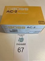 Box of BOSS AC-2 Acoustic Simulator guitar effect pedal showing branding and model number.