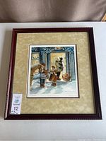 Framed print showing the full artwork with detailed holiday winter scene including a horse, children, and a lit doorway.