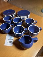 Full set showing 6 blue cups, 6 matching saucers, and one creamer.