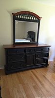 Full view of wooden dresser and mirror showing overall condition