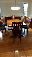 Full view of dining table with six chairs in dining room