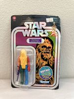 Front view of Star Wars Chewbacca Prototype Edition action figure in sealed blister pack showing retro styled design and price tag.