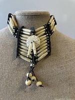 Front view of the vintage Sioux choker necklace showing bead arrangement and central circular pendant with hanging beads.