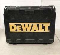 Closed black hard plastic case with yellow DeWalt logo on front.
