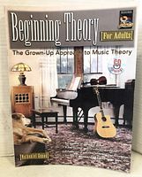 Photo of book cover showing piano, guitar, and dog with title and author's name.