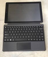 Top view of the tablet screen and attached keyboard with QWERTY layout, detailing keyboard keys and touchpad area.