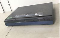 Front view of Sony BDP-S301 Blu-Ray Disc Player showing the disc tray, control buttons, and Sony branding.