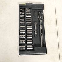22 piece socket set in black tray including ratchet wrench, extension bar, and 20 sockets of various sizes.