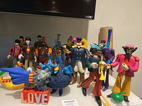 Wide shot of all figures and accessories on tabletop under television