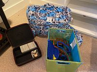 Large camouflage cushion propped against a wall near the other items