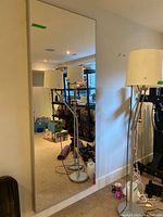 Mirror mounted on wall reflecting room interior