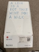 Top of box showing slogan 'A line is a dot that went for a walk', Scribit branding and design award logos