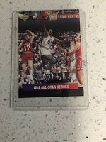Front view of the basketball trading card showing Robert Parish during a game.